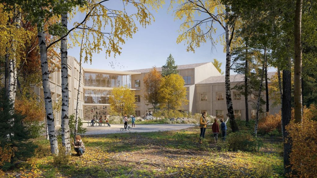 Y-shaped Hånes School building integrated with surrounding forest in Kristiansand.